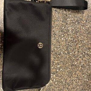 Lululemon black with gold hardware large wristlet excellent condition